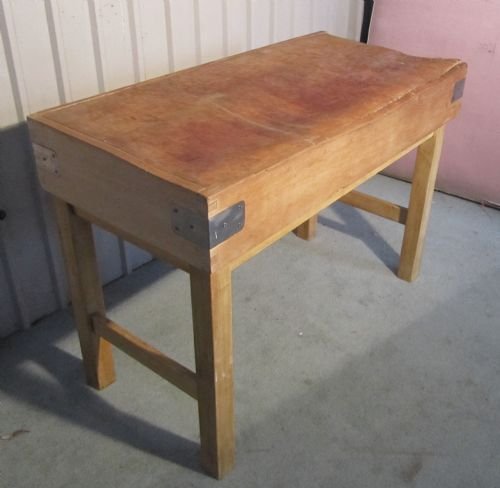 a french vintage butchers chopping block on stand