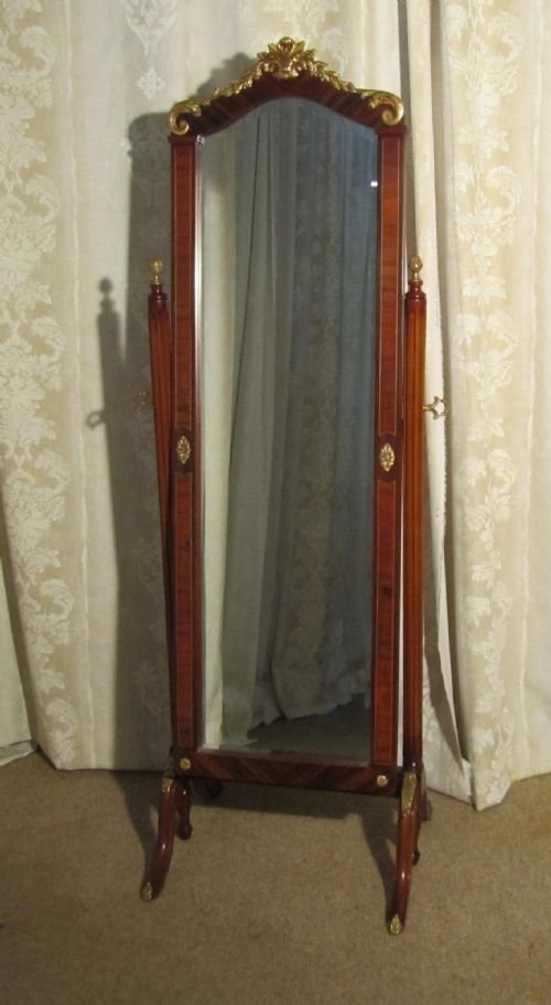 an inlaid and ormolu mahogany cheval mirror
