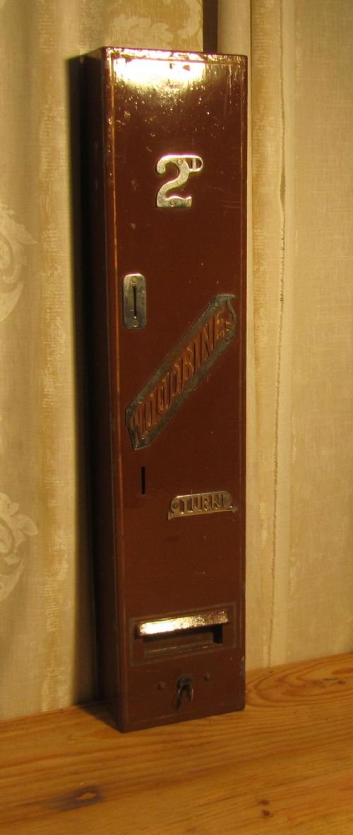 a vintage iron cigarette vending machine woodbine