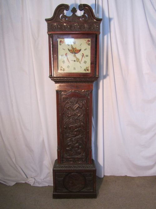 georgian carved oak and inlaid mahogany longcase clock