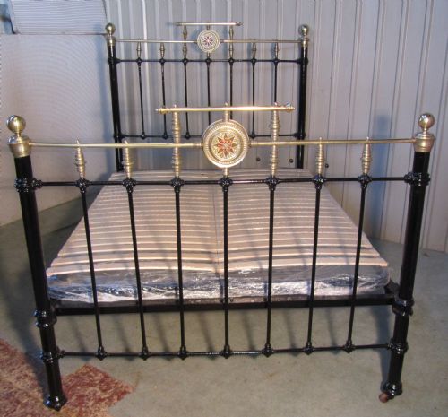 a good 19th century brass and iron double bed