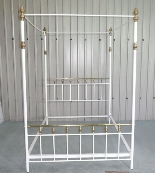 brass and iron four poster painted double bed