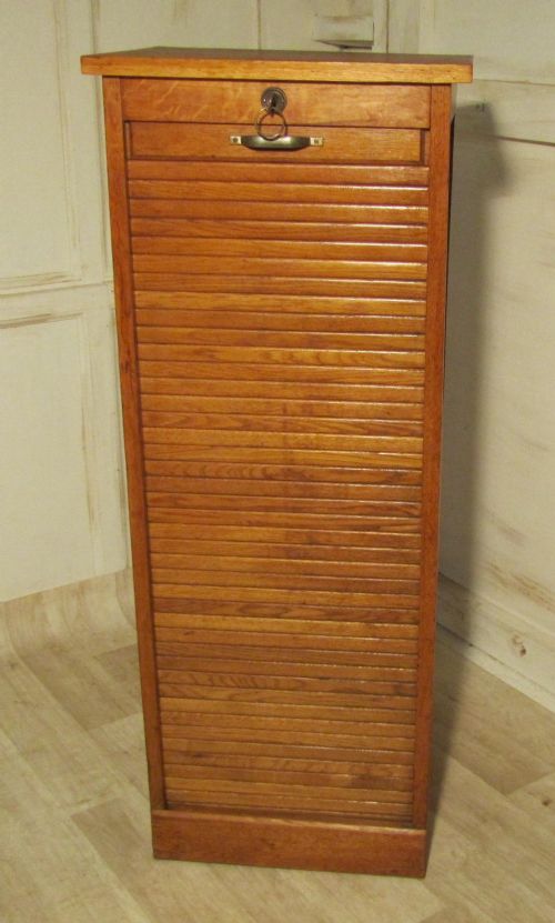 a french tambour fronted oak art deco filing cabinet