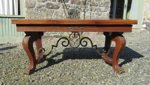 a large 19th century carved and parquetry oak draw leaf table