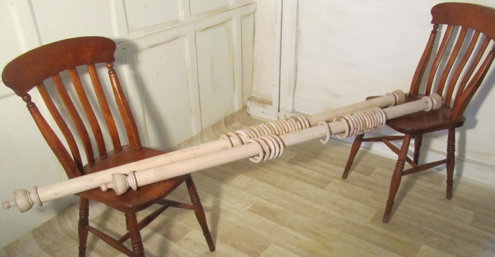 a pair of french shabby painted curtain poles