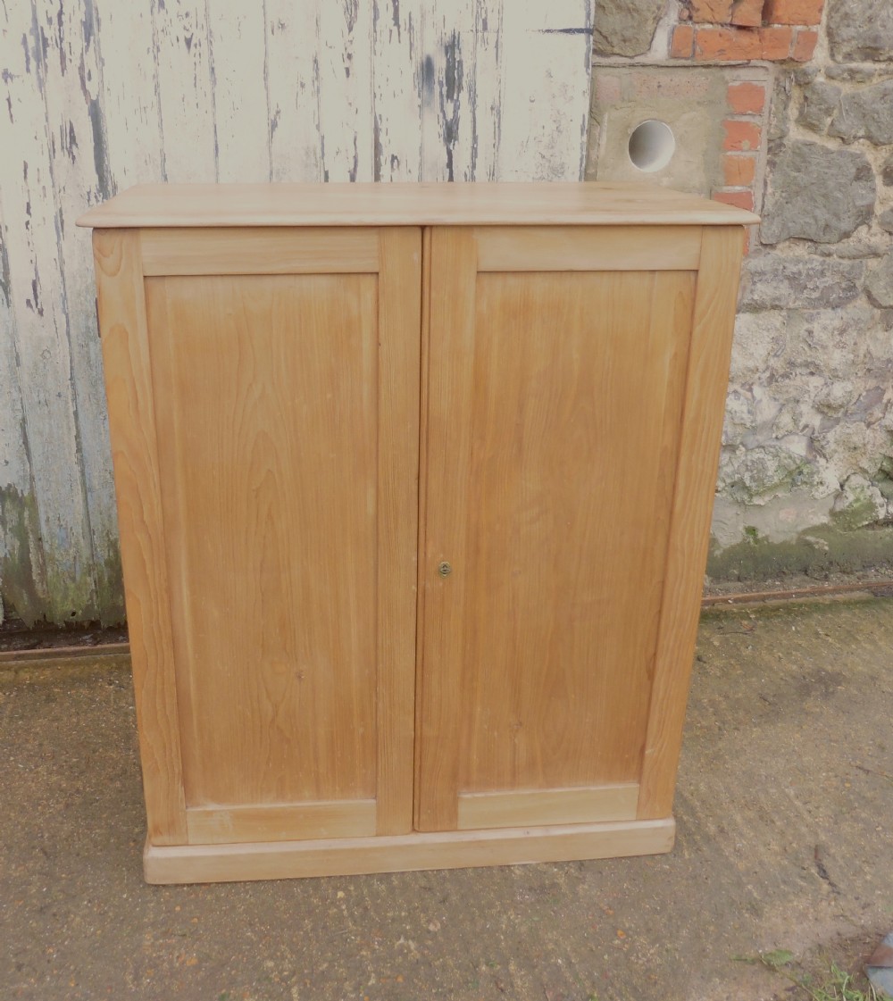a 19th century stripped pine cupboard