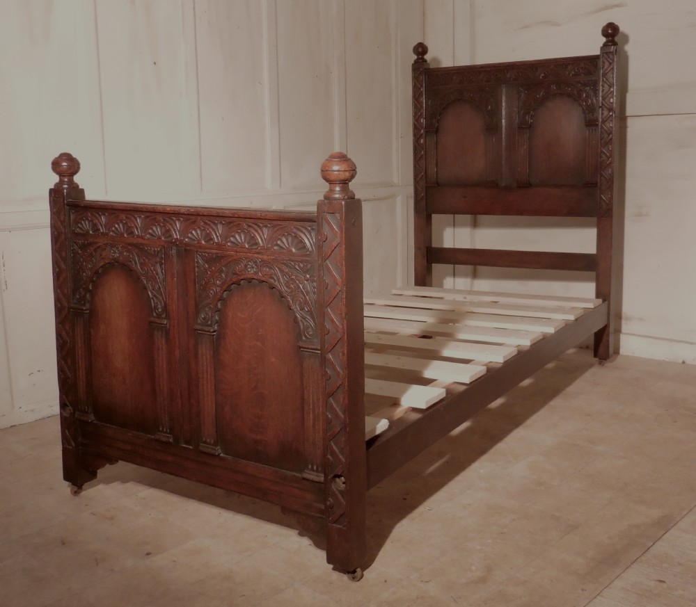 a superb victorian gothic carved oak single bed