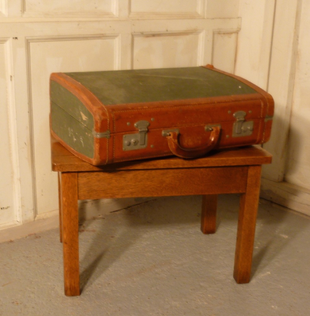 a sturdy golden oak luggage rack suitcase stand