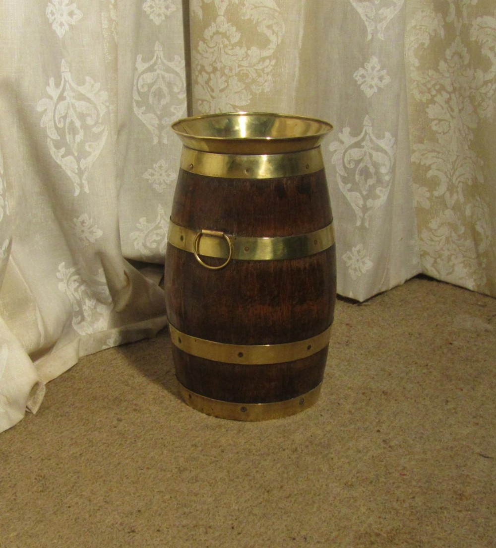 a brass and oak stick stand