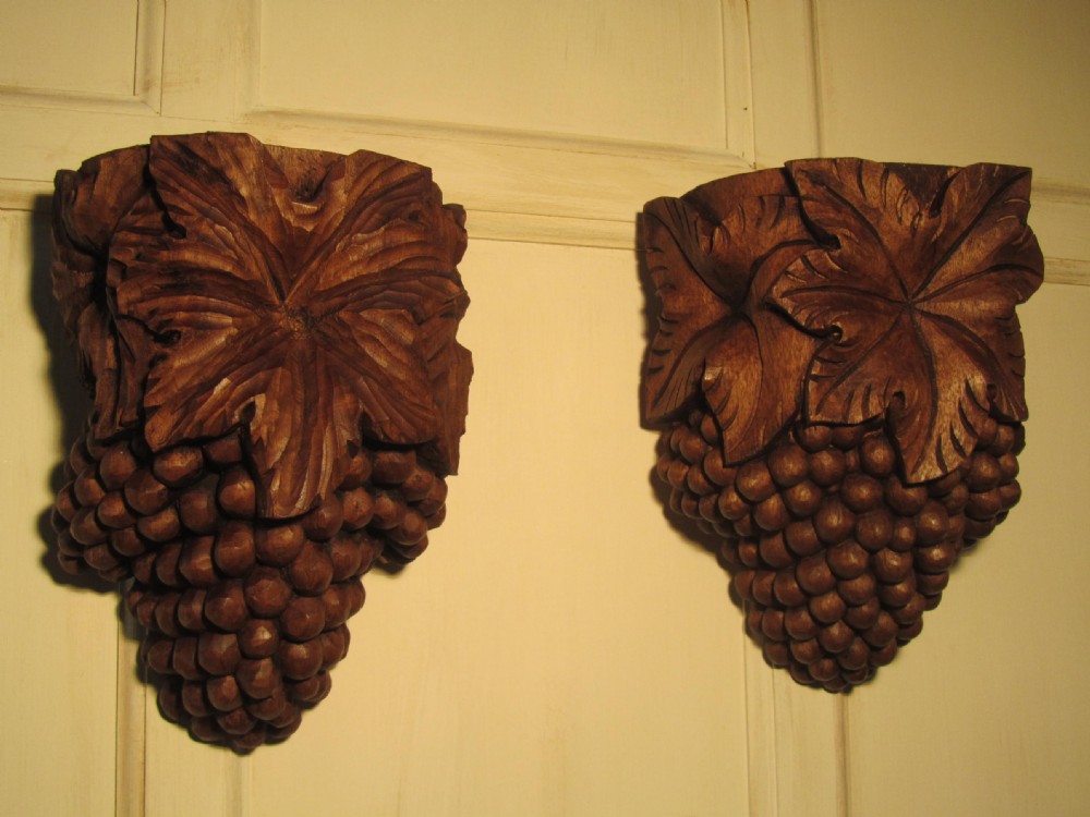 a pair of carved wall brackets grape vine leaf