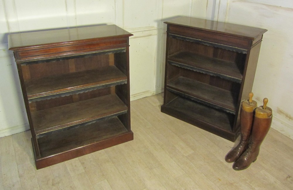 a superb pair of chippendale style mahogany open bookcases