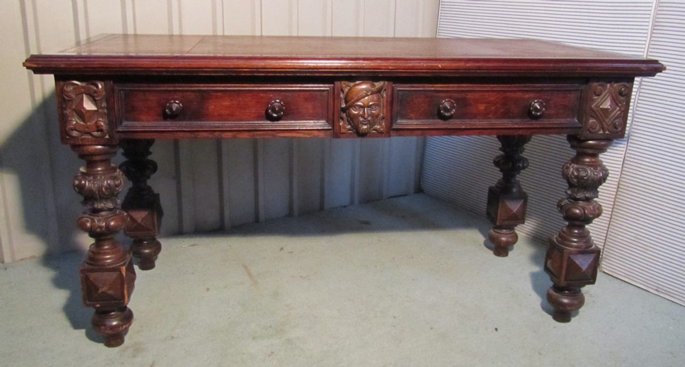 a victorian carved oak desk 0r writing table