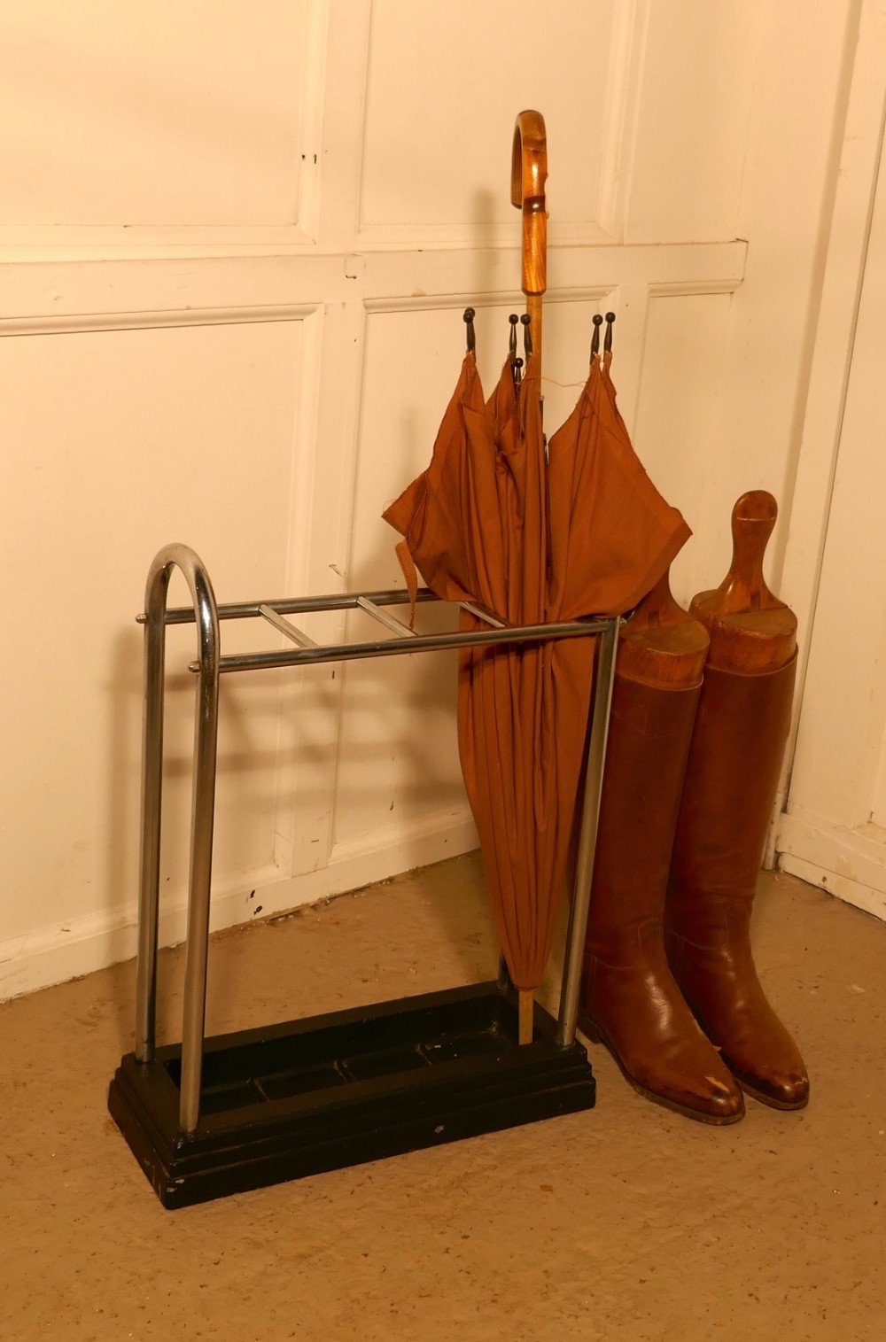 an art deco chrome and cast iron stick stand or umbrella stand