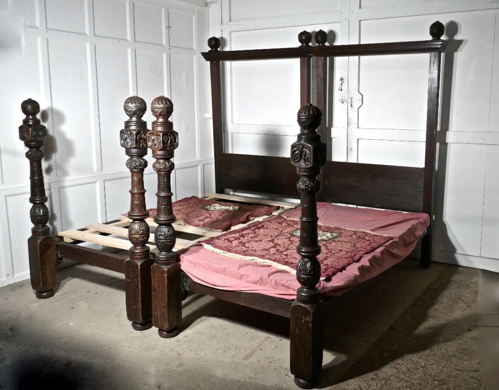 a pair of gothic carved oak 4 poster beds