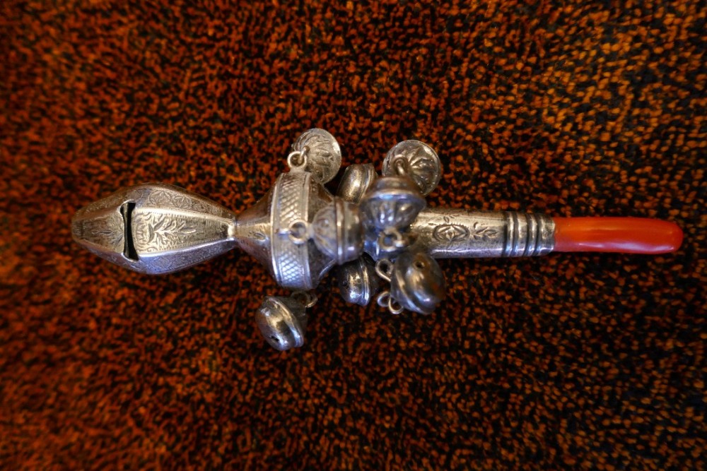 a 19th century silver baby rattle with bells whistle and coralteether