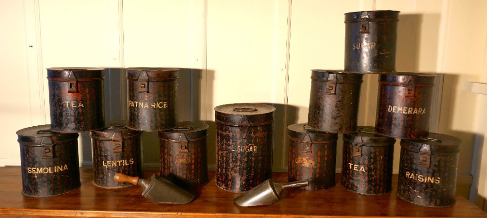 12 large victorian grocers tolewear canisters and tins with scoops