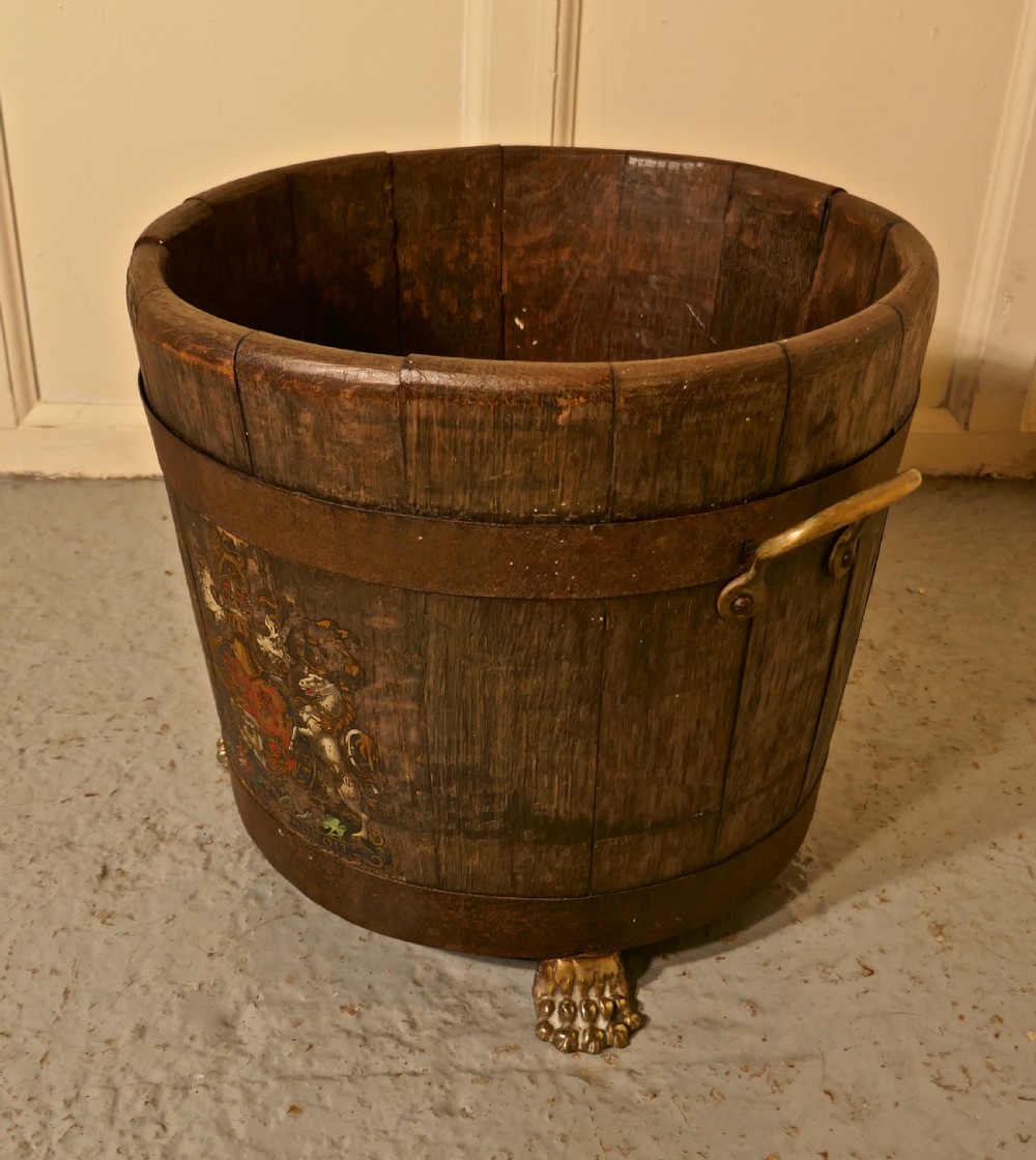 an oak iron bound ships barrel with the royal coat of arms
