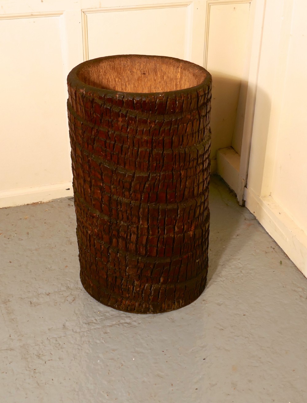 quirky stick stand from hollow tree trunk palm tree fern