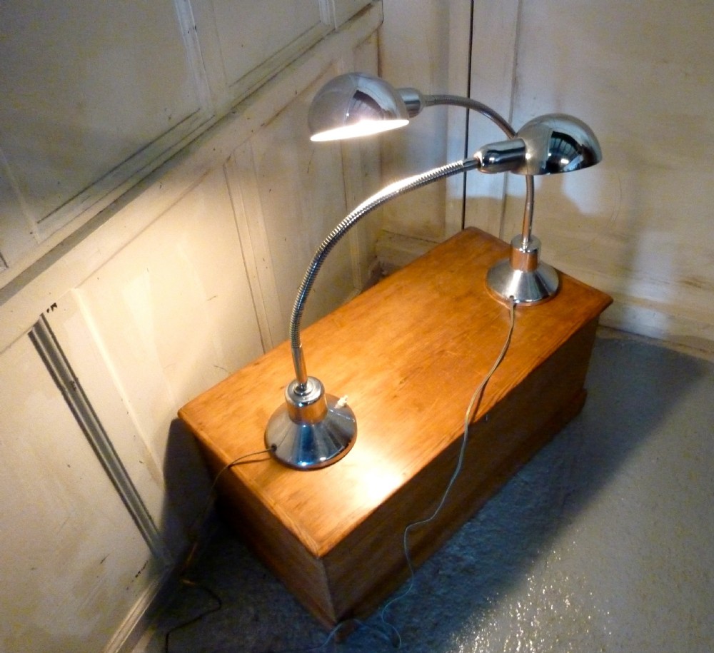 a pair of vintage retro french chrome angle poise desk lamps