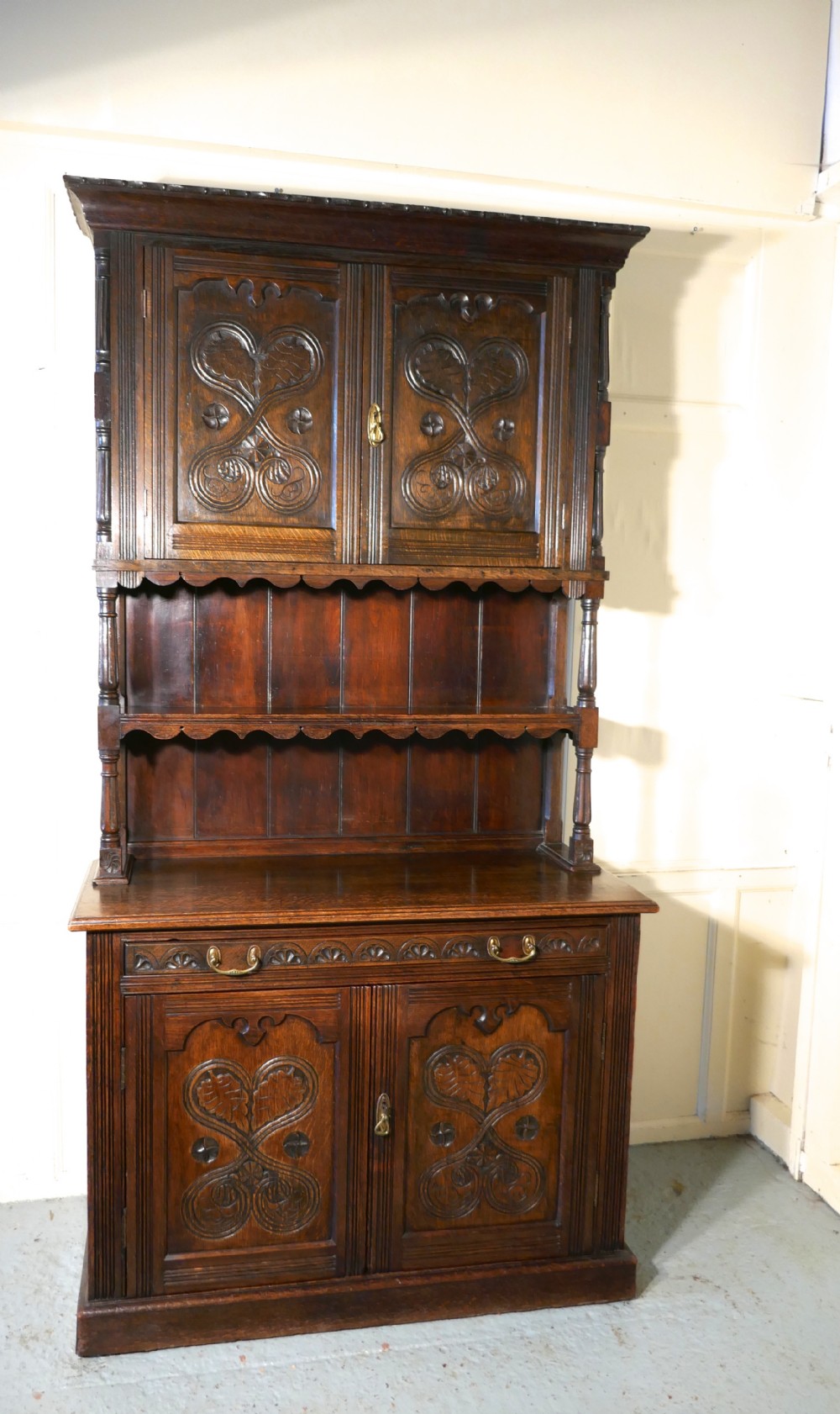 an 19th century gothic oak welsh housekeepers cupboard