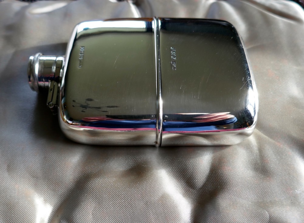 a solid silver hall marked hip flask and cup by daniel arter