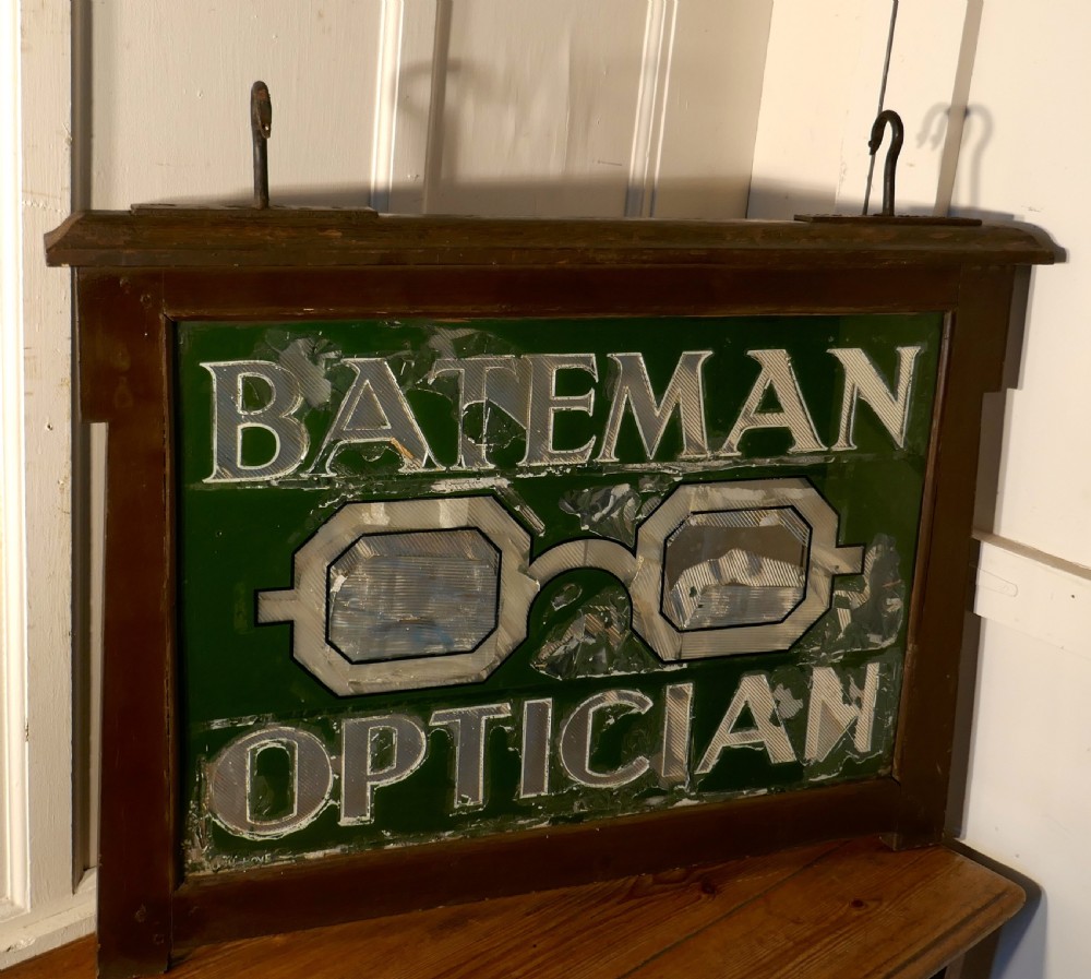 large bateman opticians advertising shop sign