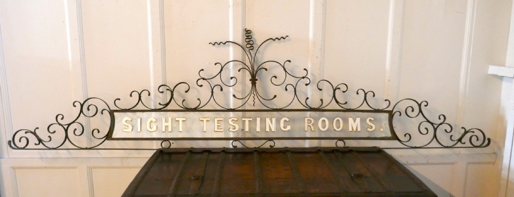 large opticians sight testing room shop sign
