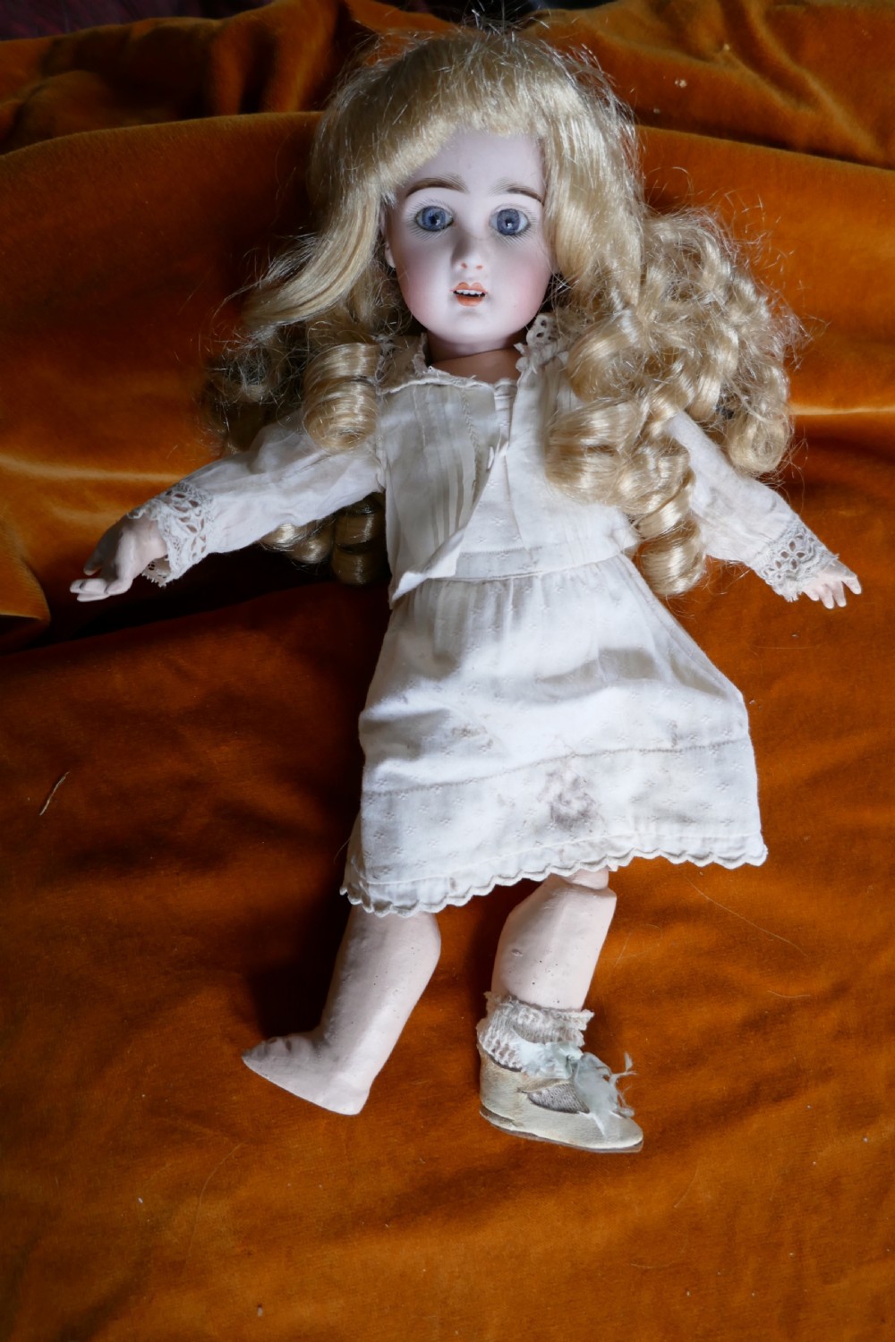 19th century character doll with wig and clothes