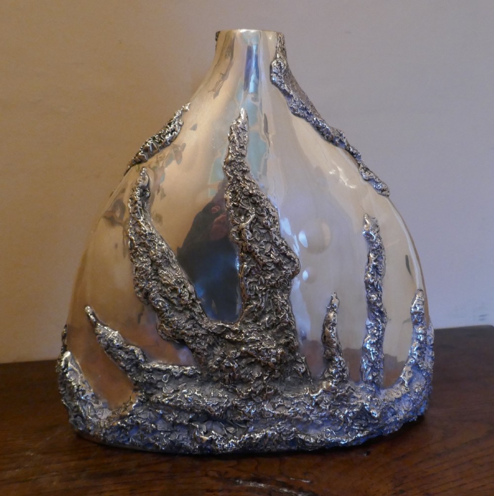 a large unusual silver plated volcanic vase signed by sima abraham