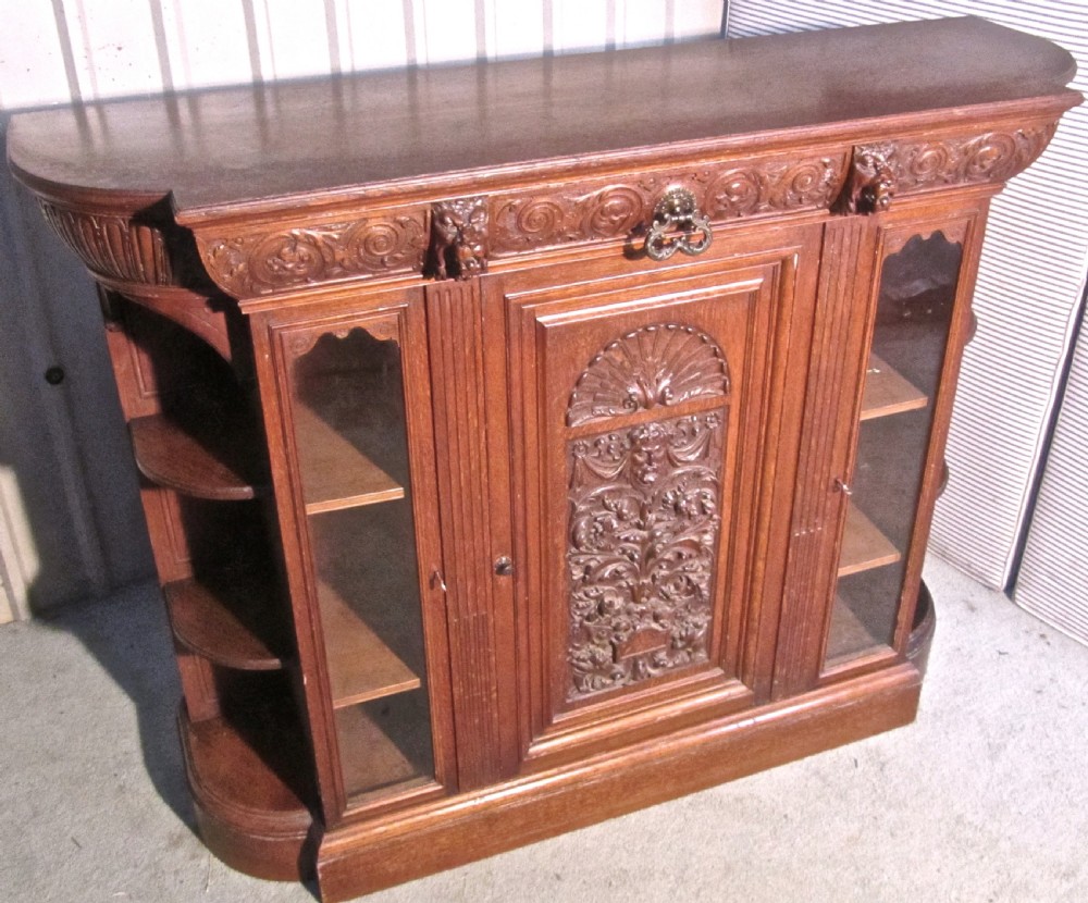 a gothic arts and crafts carved golden oak sideboard by gillows 1870