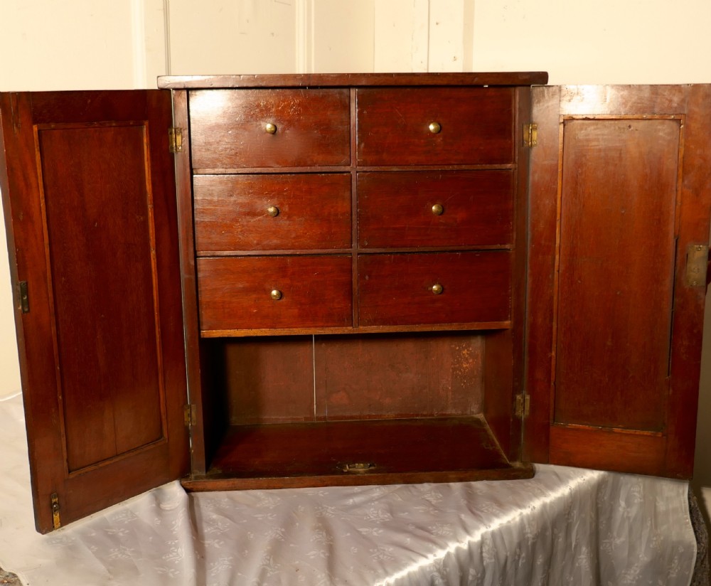 a victorian mahogany collectors cabinet with interior drawers