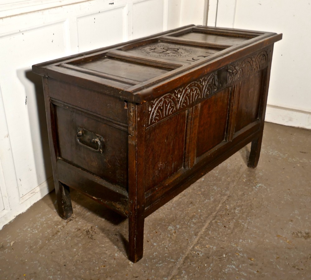 a small early 17th century carved oak coffer 1621