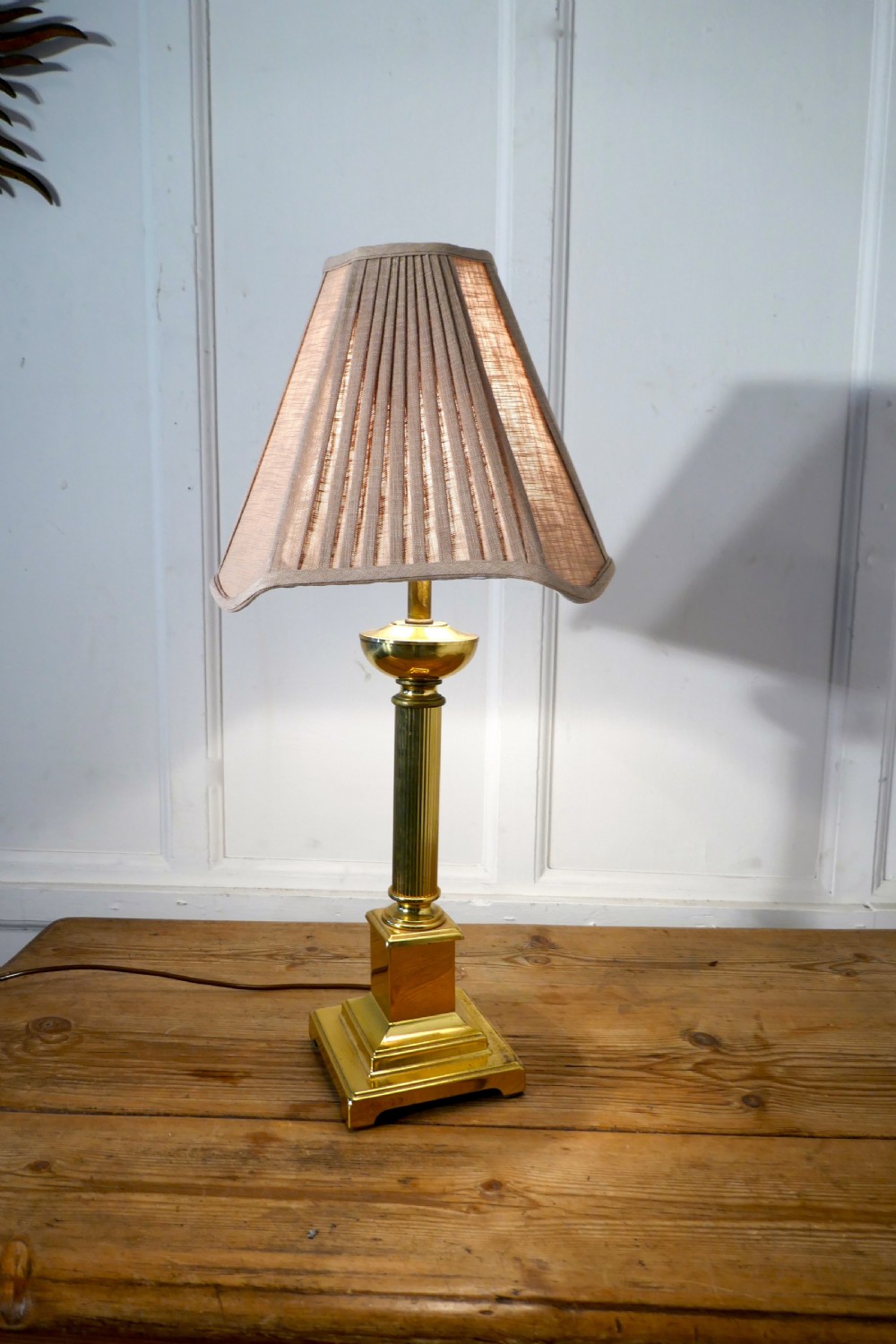 corinthian column brass table lamp with pleated linen shade