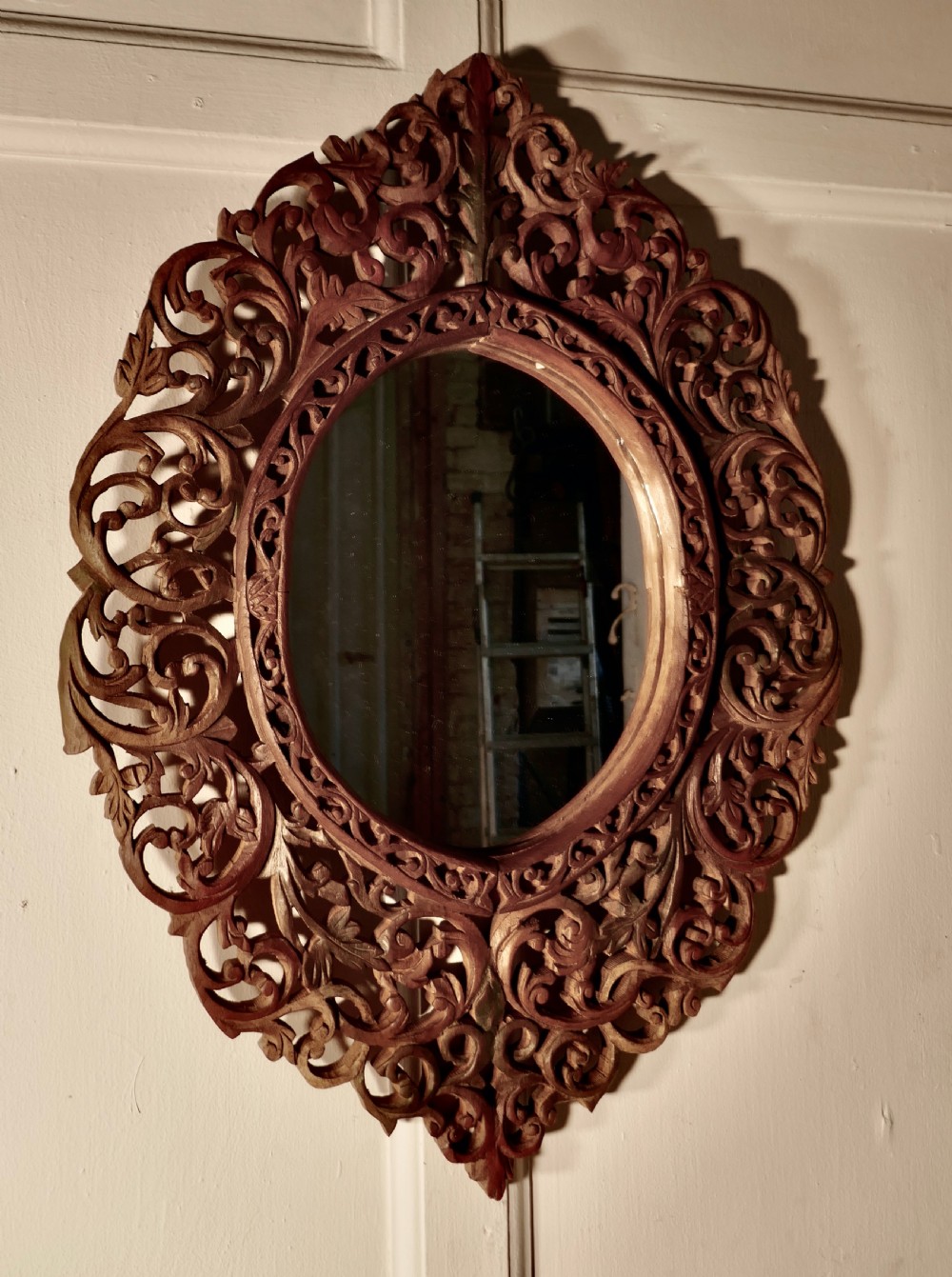 intricately carved islamic oval mirror