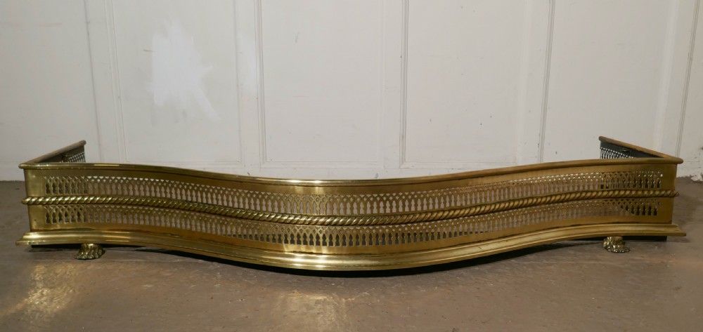 large victorian serpentine shaped pierced brass fender