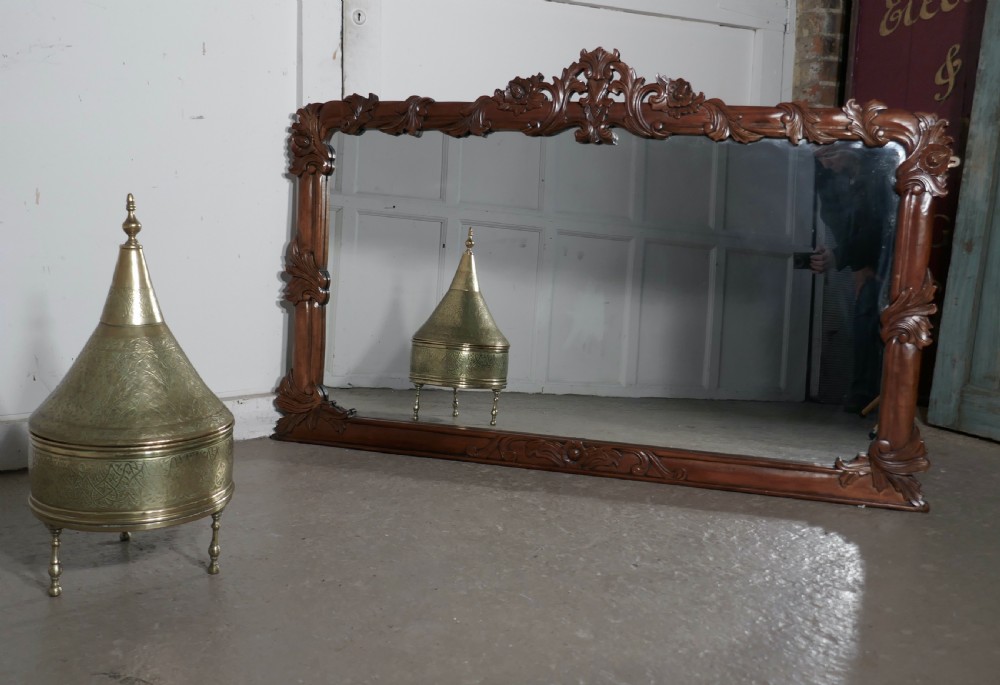 a superb large carved mahogany overmantel mirror