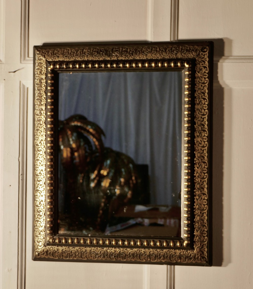 stunning french empire gilt brass and black lacquer wall mirror