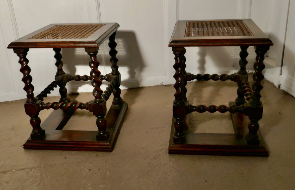 a pair of oak barleytwist and bergre fireside stools