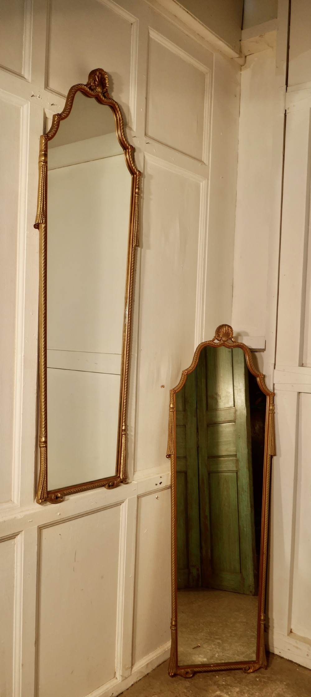 a pair of art deco long gilt wall mirrors