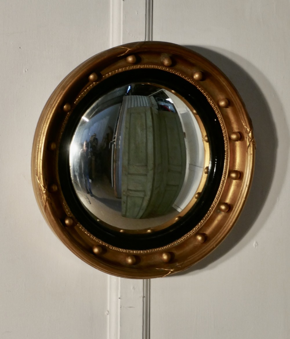 regency convex gilt wall mirror
