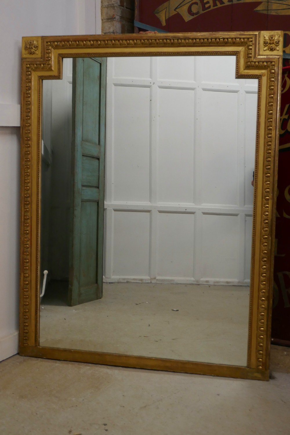 very large french gilt over mantle mirror