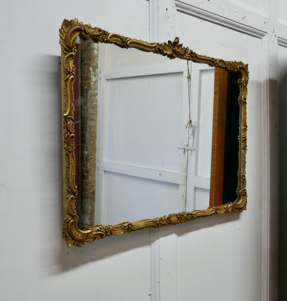 a regency style gilt wall mirror