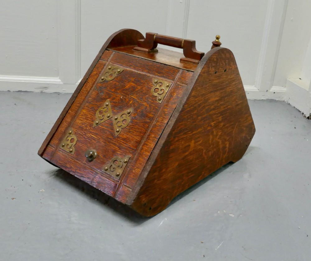 a victorian oak coal box with liner and shovel