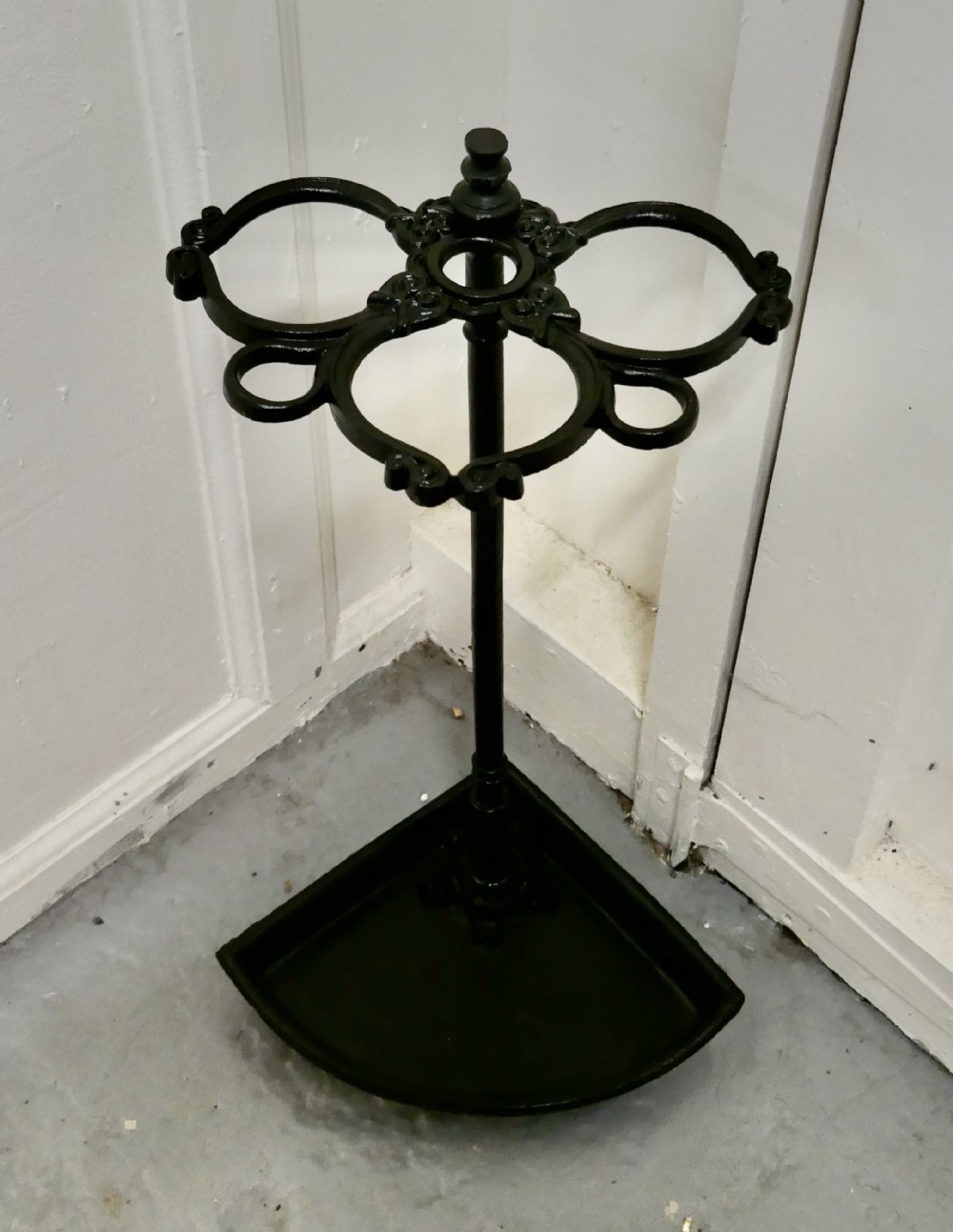 a victorian cast iron corner stick and umbrella stand