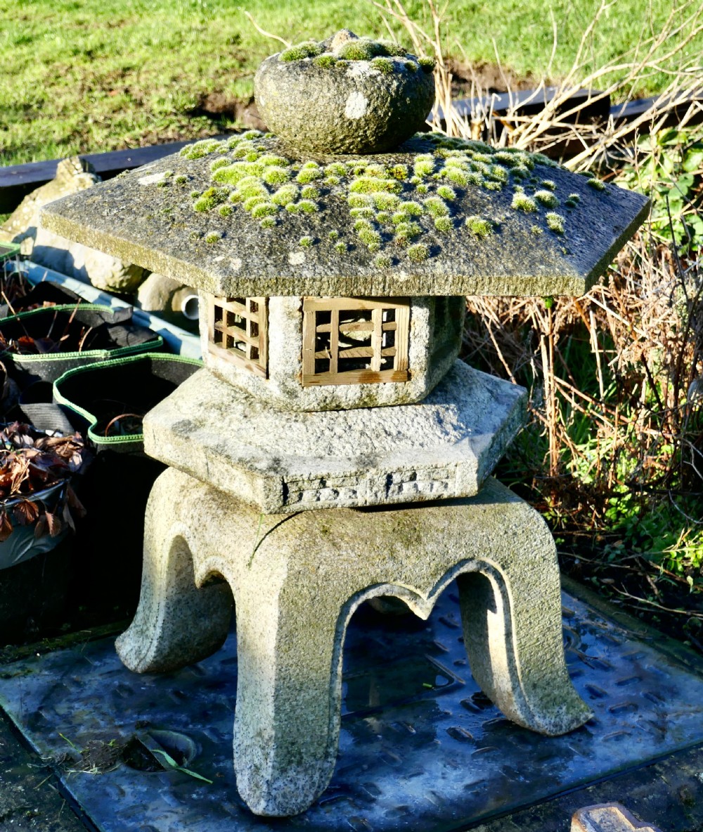 weather worn granite pagoda garden ornament lantern