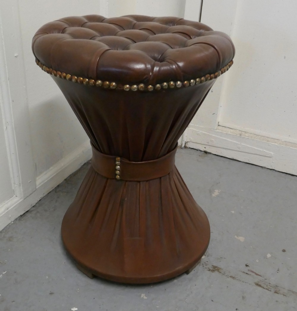 deeply buttoned tam tam leather stool