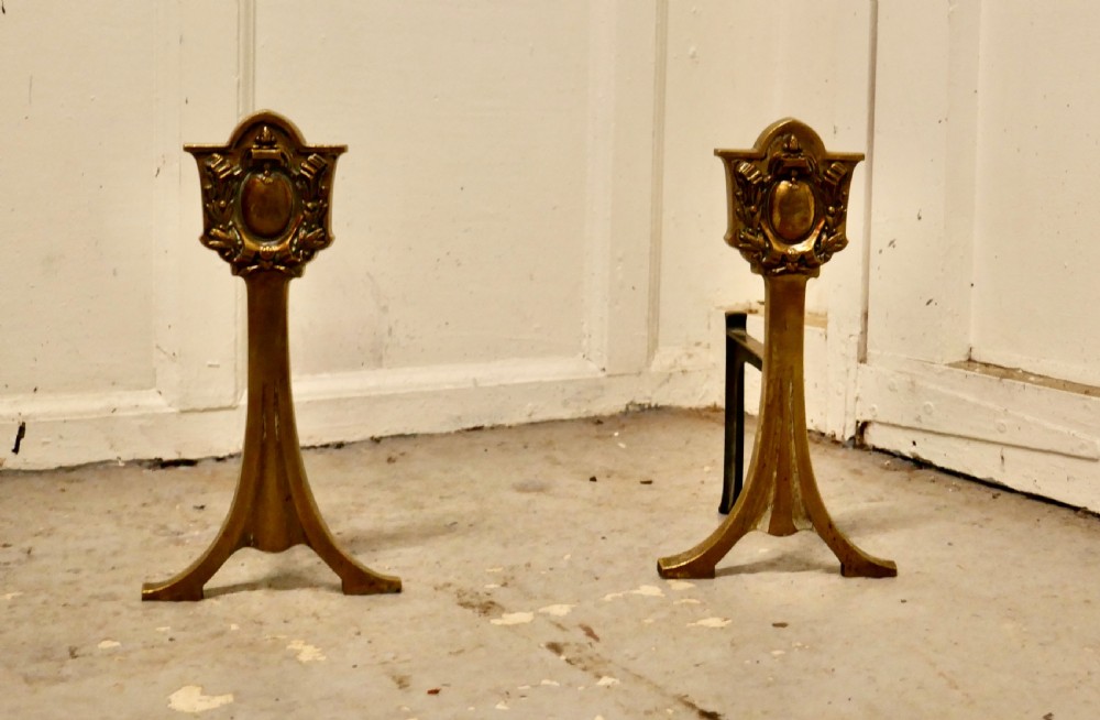 an elegant pair of 19th century brass andirons or fire dogs