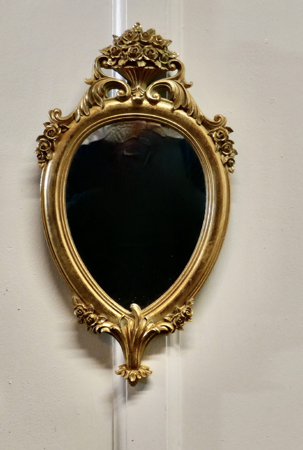 small rococo gilt wall mirror