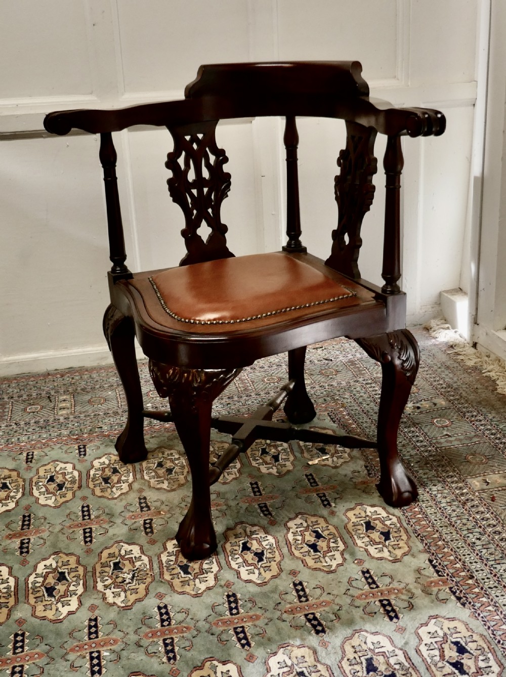 a chunky georgian style mahogany corner arm chair