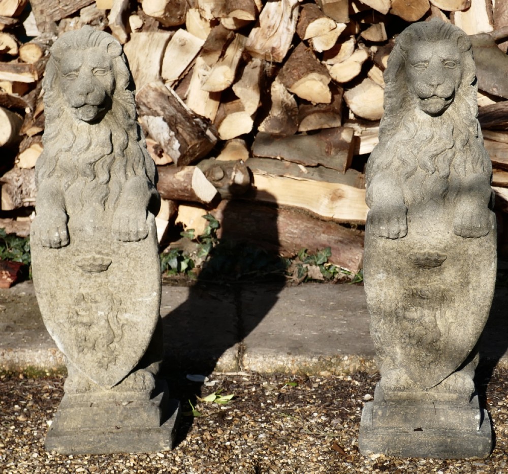 pair of large sculptures of english stone heraldic lions